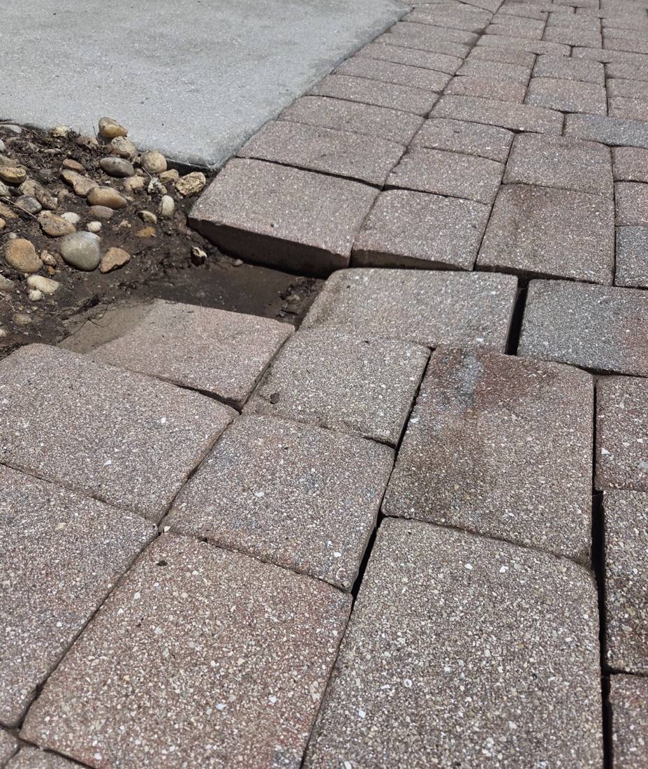 Sunken, separated pavers before repair