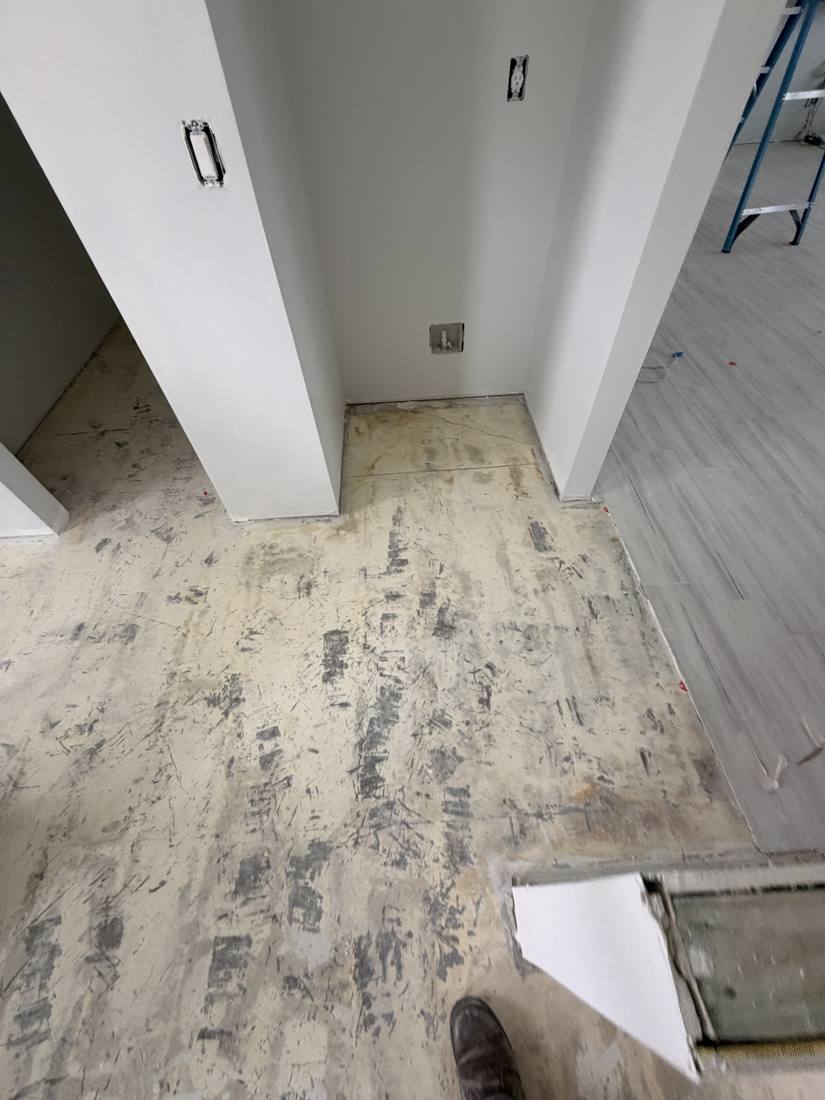 Subfloor scraped clean after tile removal