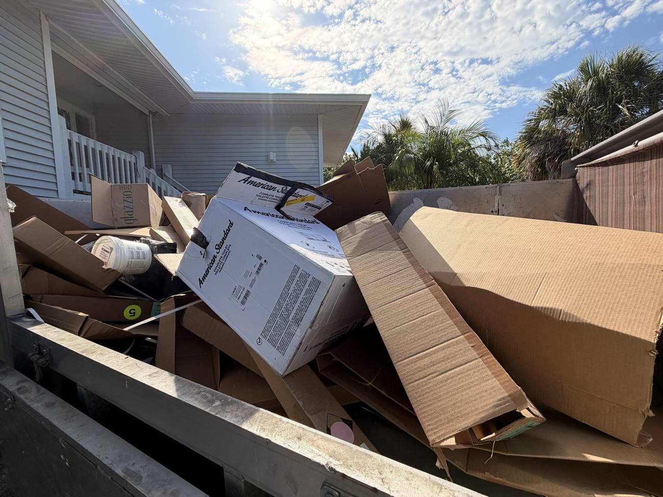 Trailer loaded with boxes and renovation debris