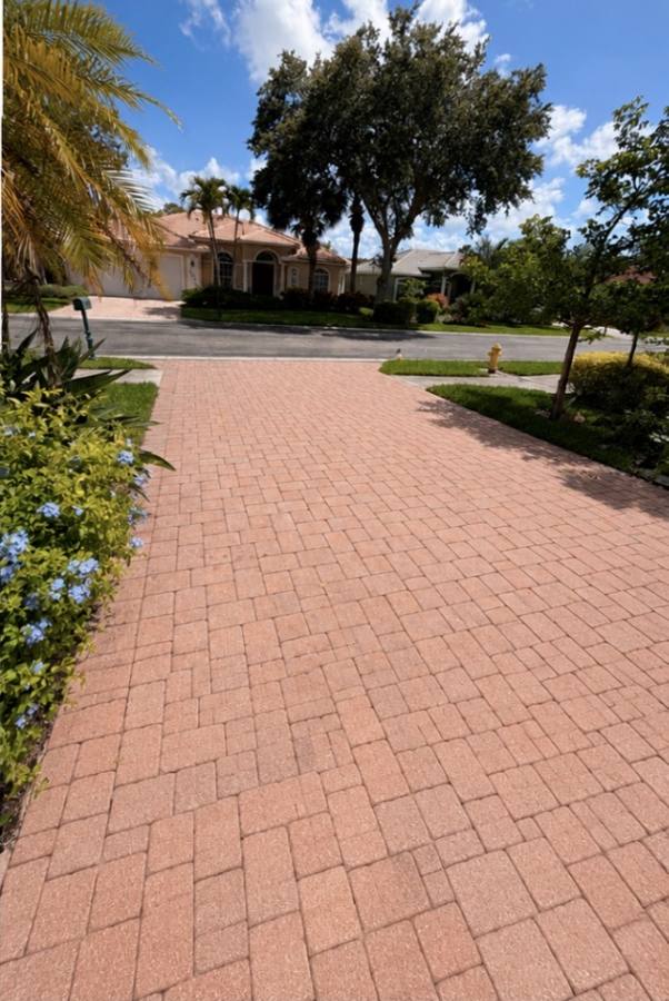 Freshly pressure washed paver driveway